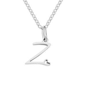 Macro shot of silver letter Z pendant with a tiny hollow heart on a polished link chain