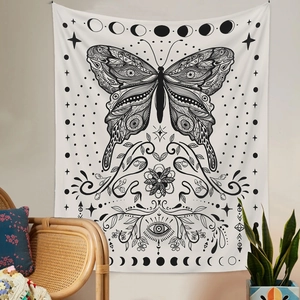 Detailed view of sun and moon moth tapestry with mystic symbols in a cozy room setting