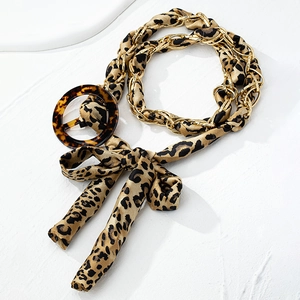 Leopard print fabric belt with gold chain weave and tortoise shell round buckle