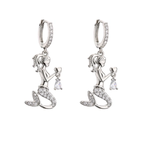 Detailed macro view of silver mermaid earrings featuring crystal heart and pear-shaped drops