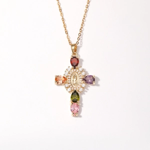 Vintage gold cross pendant with colorful gemstones and virgin mary relief center
