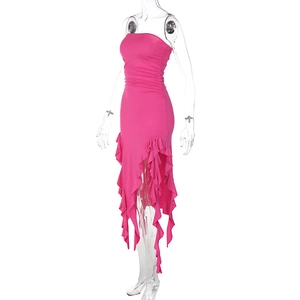 Detail of rose red tube dress featuring ruched waist and asymmetrical ruffled hemline