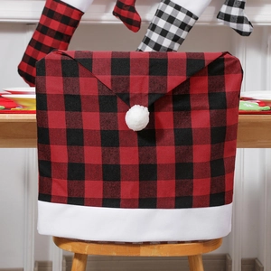Christmas chair cover in red and black plaid with white fur trim for holiday dining decor
