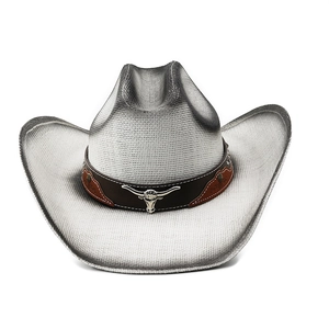 Detail view of woven straw cowboy hat with leather band and silver bull head emblem