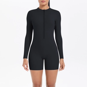Detail of black athletic bodysuit featuring half-zip front and elastic fit design