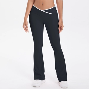 Detail of high waisted yoga flare pants featuring a V-shaped crossover waist with white trim