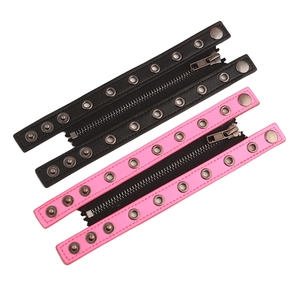 Wide punk leather bracelet with central zipper and bronze studs in black and pink