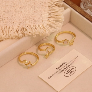 Three-piece gold plated open ring set with white shell heart and star moon patterns