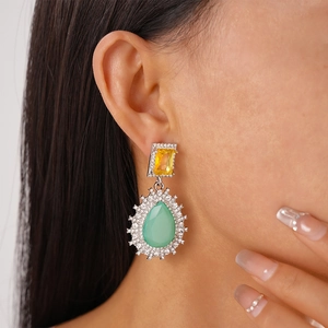 Vintage teardrop drop earrings with yellow and mint green crystals in silver finish