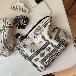 Detail of bohemian printed cotton linen makeup bags with zipper and simple wish label