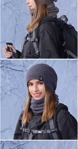 Detail of dark grey knit beanie and neck warmer set with diamond pattern in snowy forest