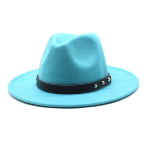 Detailed close-up of blue wide-brim wool fedora hat with black leather band and silver studs