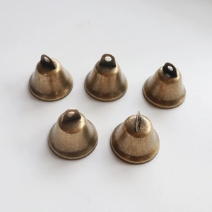 Five vintage bronze 3.8cm open bells with hanging rings for DIY crafts on white background