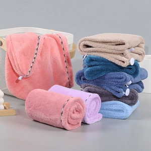 Absorbent coral fleece hair drying towel caps in various colors with secure button closure