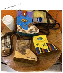 Detailed overhead view of plush boot-shaped crossbody bags in cow print and star patterns