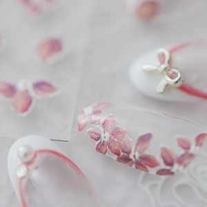 5D Japanese style nail stickers featuring pink floral patterns and silver bow accents