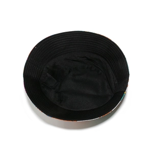 Detail of sun hat with colorful graffiti pattern and black inner lining stitching