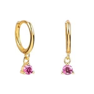 Detail of gold hoop earrings featuring round pink cubic zirconia in three-prong settings