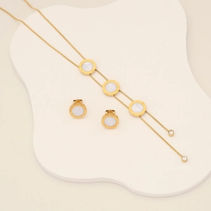 Golden stainless steel jewelry set featuring Roman numeral shell heart necklace and earrings
