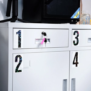 Detail of reflective 4-inch vinyl mailbox numbers 1-4 with laser glitter finish