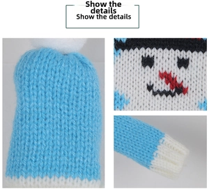 Detailed macro view of the knitted snowman wine bottle cover with blue and white textures