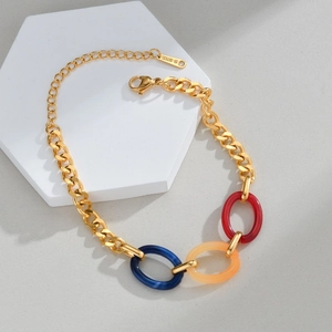 Detailed close-up of 18K gold-plated stainless steel chain with colorful acrylic oval links