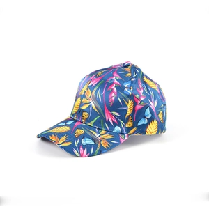Detail of navy baseball cap featuring vibrant tropical flower and butterfly prints