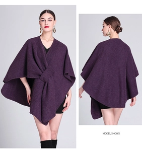 Detail view showing front and back of deep purple knitted poncho with knotted waist