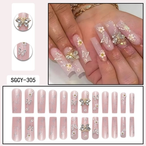 Long square press-on nails with silver glitter, 3D butterflies and white flower accents