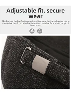 Close-up of adjustable metal buckle on dark gray plaid winter cap for a secure fit