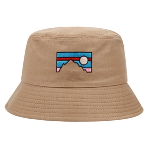 Classic khaki cotton bucket hat with embroidered mountain landscape on white background