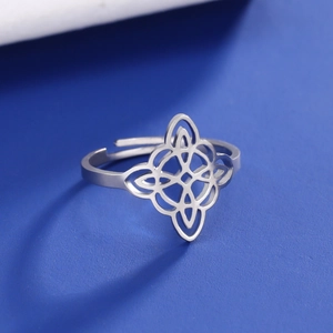 Detailed close-up of a silver stainless steel double-layered witch's knot open ring