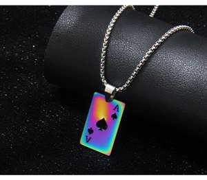 Macro shot of stainless steel rectangular Ace of Spades pendant with rainbow finish