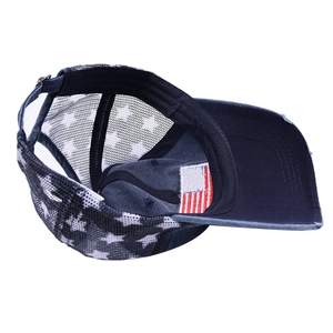 Detail of distressed denim baseball cap with American flag label and star mesh back