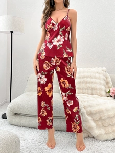 Detail of burgundy floral satin loungewear set with camisole top and straight trousers
