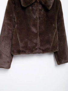 Close-up of the thick brown faux fur texture and lapel design on this winter jacket
