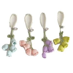 Handmade crochet lily of the valley pearl keychains in blue pink purple and green