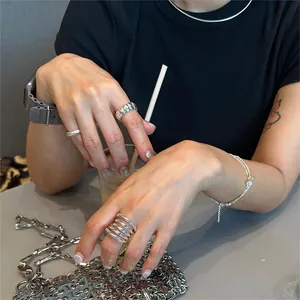 Minimalist stackable silver rings and matching bracelet set worn for daily style