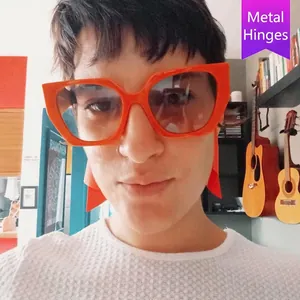 Fashionable orange cat eye sunglasses with metal hinges and gradient lenses for women