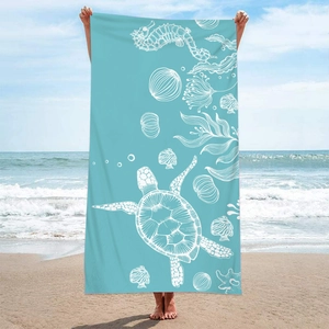 Detailed beach towel with sea turtle and jellyfish print on light blue fast-dry fabric