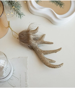 Detail of golden glitter reindeer antler ornament with faux fur trim for Christmas trees