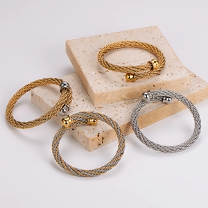 Braided stainless steel cable open bangles in gold and silver finish with ball ends