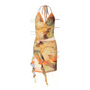 Detail of summer halter dress with tie-dye print, waist metal ring and ruffled hem