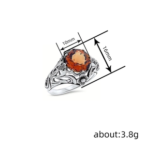 Antique silver floral engraved ring with oval orange gemstone, 3.8g weight