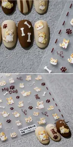 Detail showing 3D embossed Corgi dog nail stickers with cute paw and bone patterns