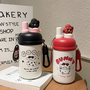 Detail of vacuum insulated cups with cartoon 3D lids and convenient carrying straps