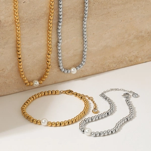 Minimalist beaded pearl jewelry set with gold and silver necklaces and bracelets