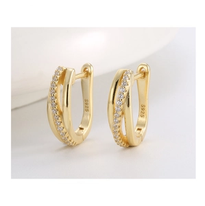 Macro shot of S925 sterling silver hoop earring with 14K gold plating and pavé cubic zirconia