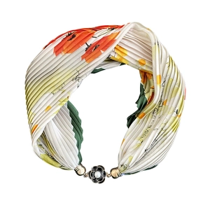 Pleated floral silk scarf necklace with magnetic pearl buckle on a white background