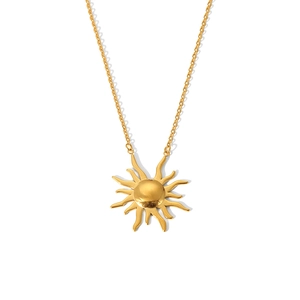 Detail shot of golden sun pendant necklace with wavy rays on a minimalist metal chain